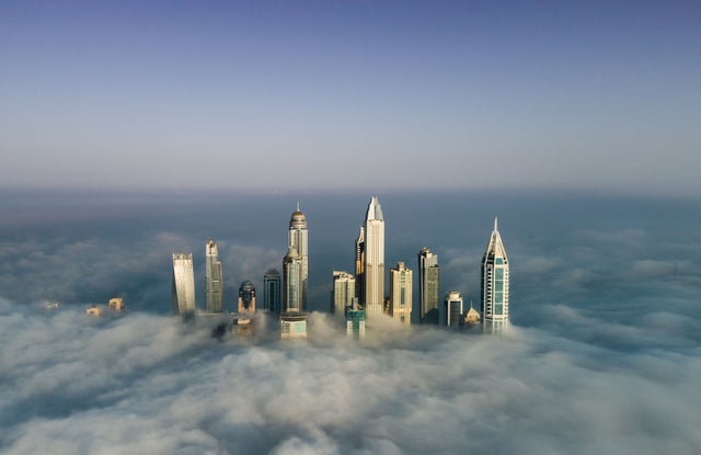 Tall buildings showing above clouds