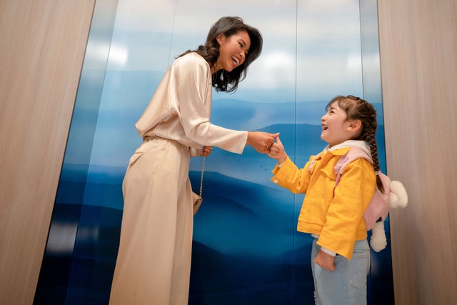 Woman and child in an elevator