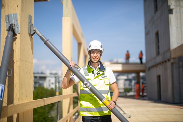 Antti Aaltonen SRV at a construction site with a helmet