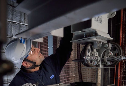 KONe technicial working on an elevator