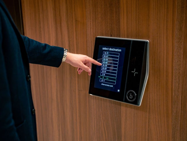 destination control screen with hand Karlatornet