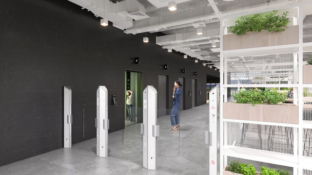 Elevator loby with turnstiles