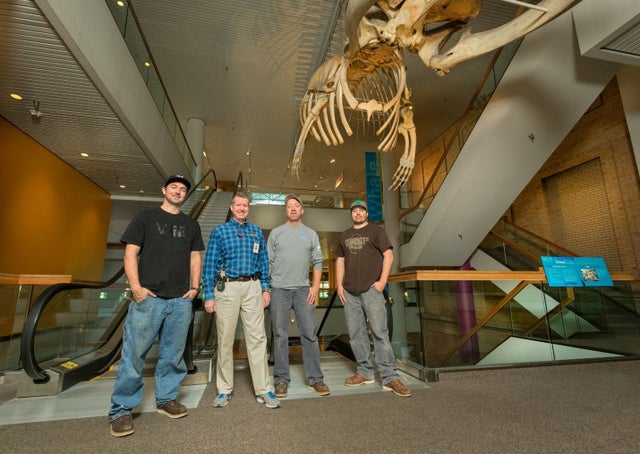 People standing inside Denver Museum of Nature and Science