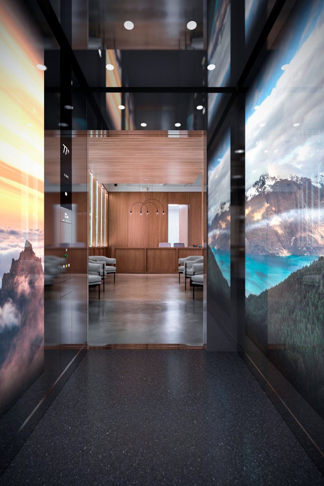 Elevator with landscape imagy on the walls