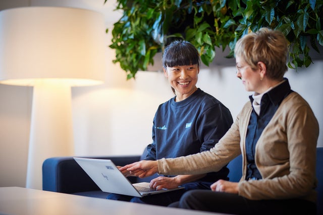 Two women looking at laptop