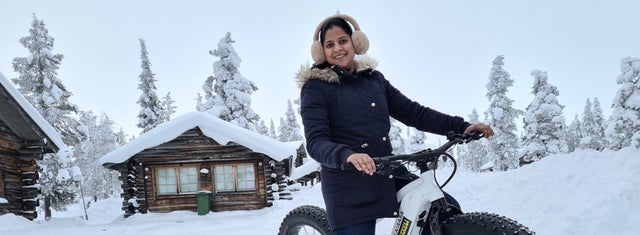 Woman on a motorcycle on winter landscape