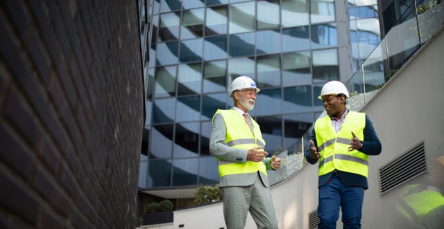 Two construction workers discussing