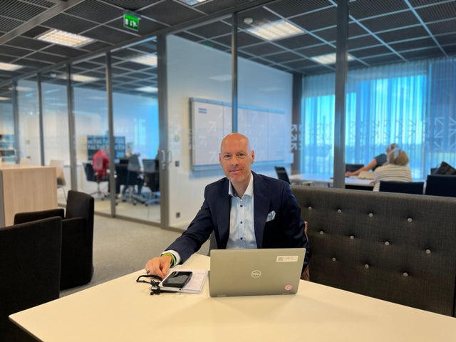 Petteri Rantanen sitting at a desk with a laptop.
