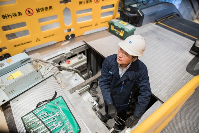KONE technician on an escalator construction site