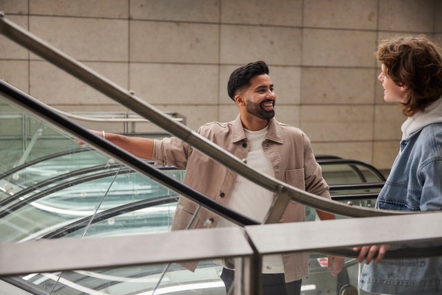 -Smiling men on escalator