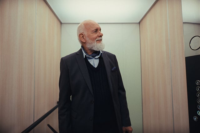Elderly person inside elevator
