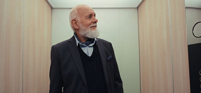 old man inside elevator