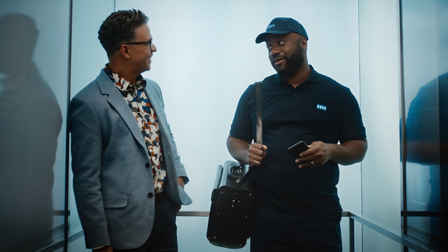 Two men in elevator