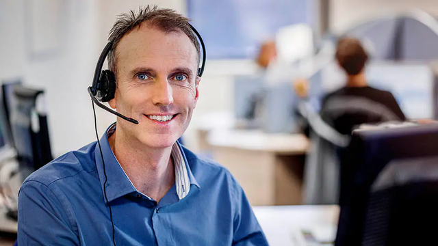 KONE employee with headphones