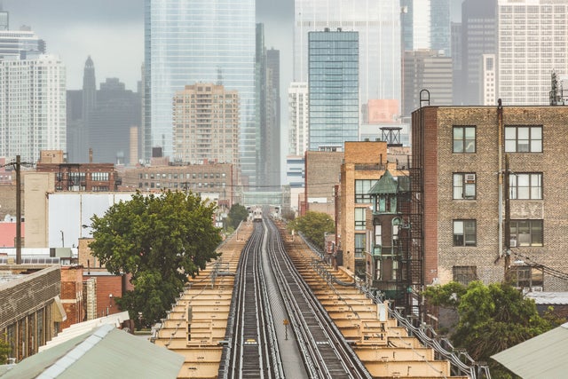 Chicago, railway view with city skyscrapers on background.