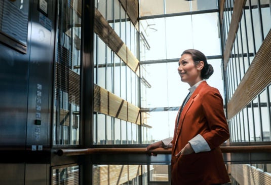 woman waiting outside elevator