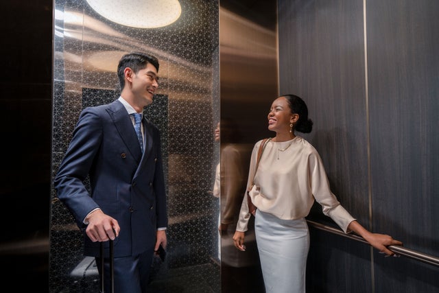 Man and woman in an elevator