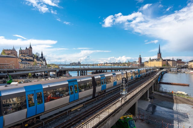 Panoramic view of the center of Stockholm. The metro train moving the Slussen district. Amazing view of the Sodermalm  island, The City Hall,  Riddarholmen in Gamla Stan. 